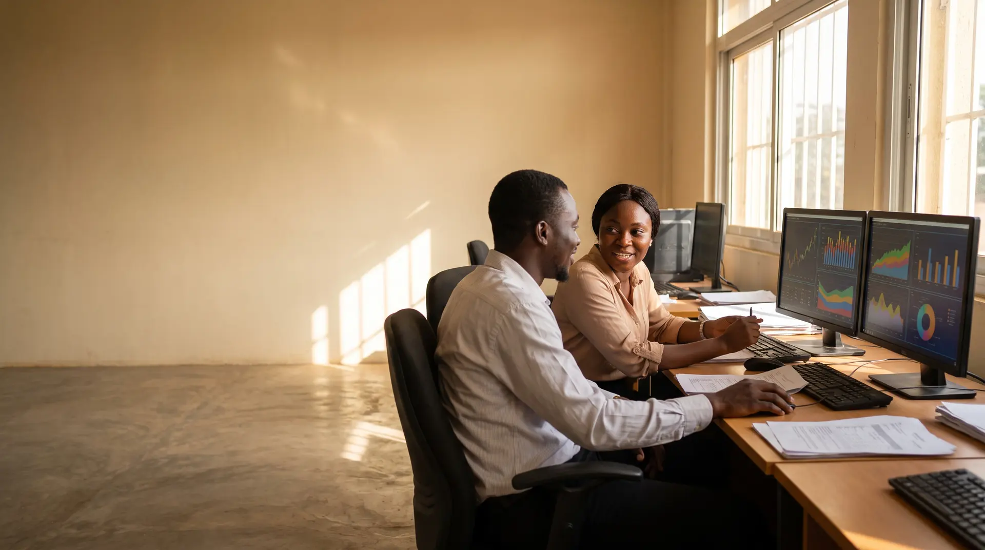 Finance officers reconciling payments on screen